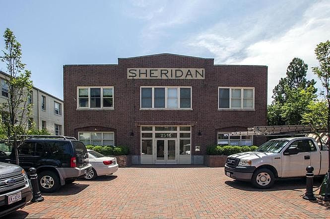 front of building. one of two parking spots is left of entrance (other in underground garage)