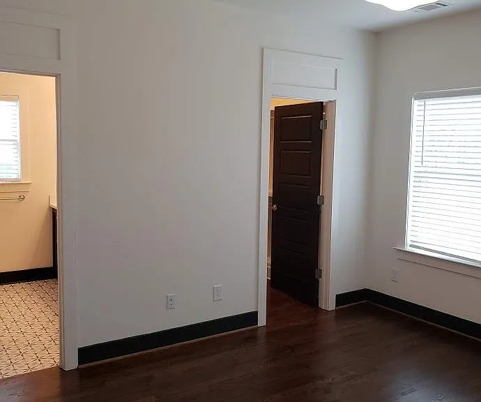 Upstairs back master bedroom shoeing closet and bathroom doorways.