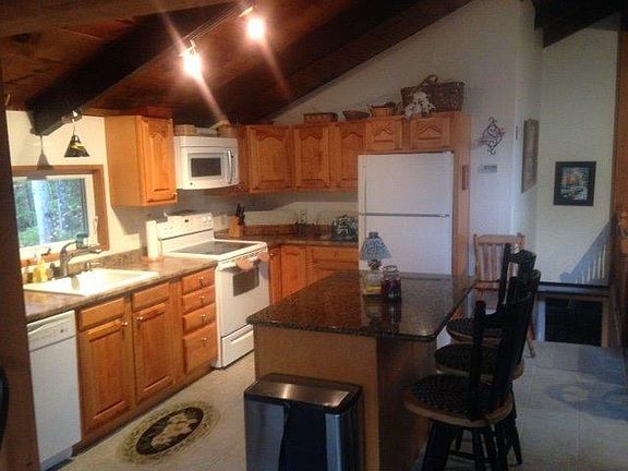 Kitchen fully equipped open to sunroom and living room