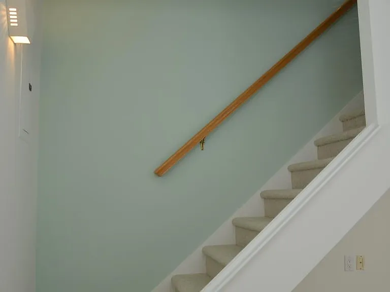 The friendly stairway to the upstairs two bedrooms and full