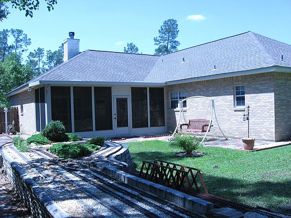 Fenced backyard w/raised railway