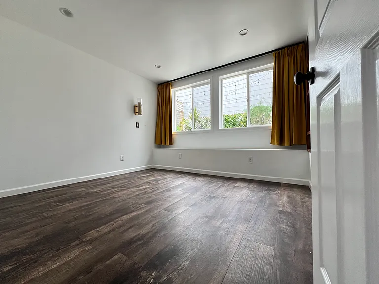 Bedroom 1. 2 giant windows facing private back yard. Yes NATURAL light galore.