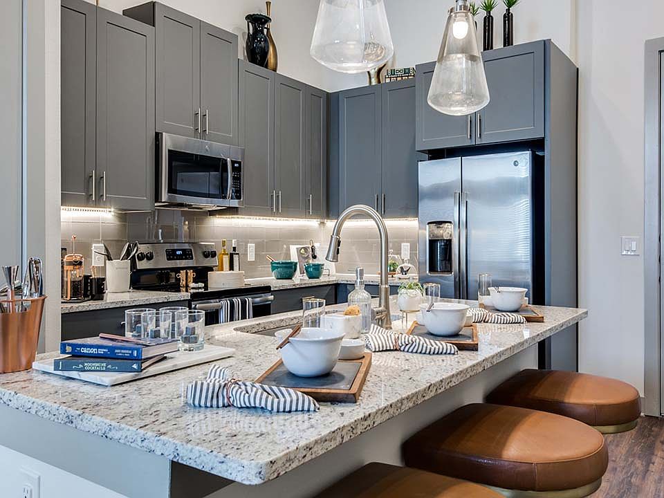 Griffis Frisco apartment kitchen with granite countertops.