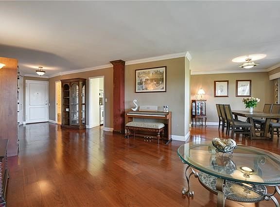 Spacious Living Room open to Dining Area with beautiful hardwood floors