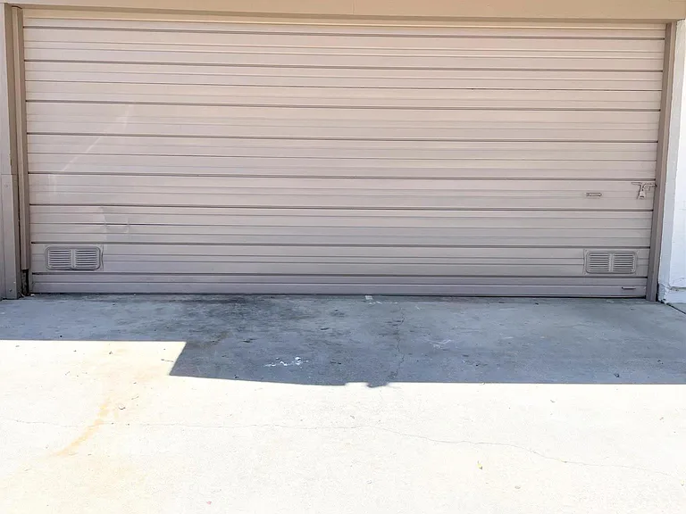 One covered garage spot & one non-garage spot