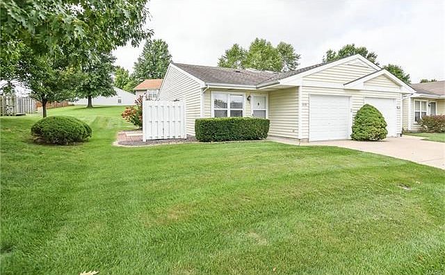 Easy living in this low maintenance home.  Generous side yard, attached garage.
