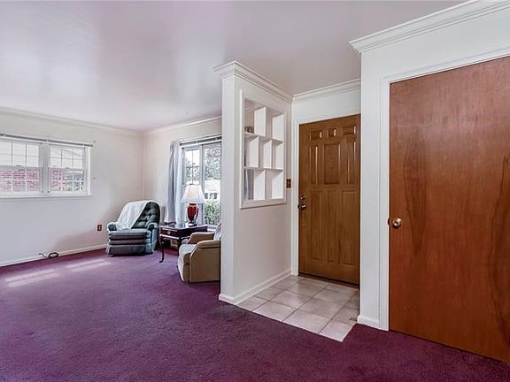 Quality built!!!!   Nicely sized foyer closet, ceramic tile, crown molding and built in shelves are features in the living space