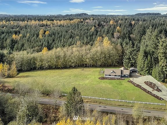 Drone view of property, nothing but land trust land behind you! Large newer circle drive. 