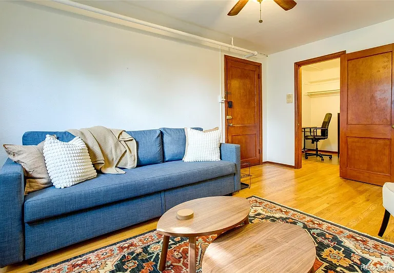 Staged living room. Bonus room/walk in close picture in rear.