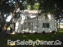 BACK OF HOUSE (true back)
						:
						Double patio doors await your deck. (On a side not pictured, is a sunroom.)