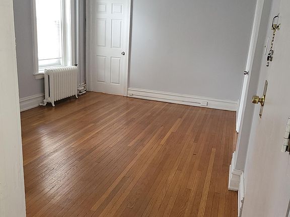 Living room with bedroom off the side and closet space