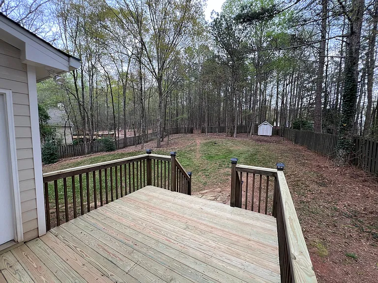 Updated deck overlooking privacy fenced backyard
