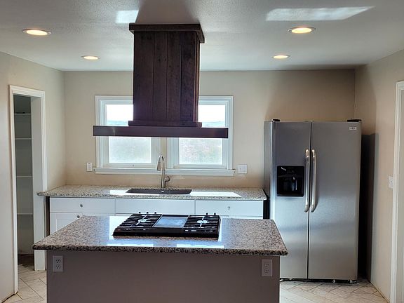 Kitchen with island cooking surface