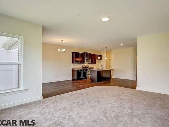 Home under construction. Completed home pictured.