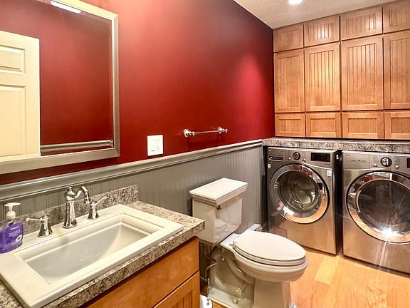 1st level 1/2 bath with laundry and storage