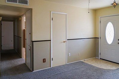 view into hall and 1st bedroom, office
