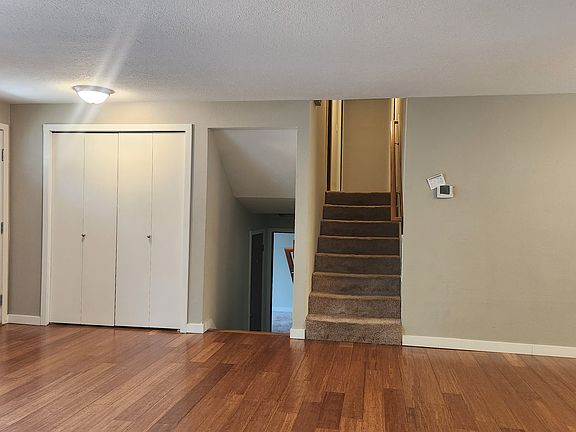 Stairs up to master suite, 2 bedrooms and hall bath
Stairs down to family room, 1 bedroom suite, laundry