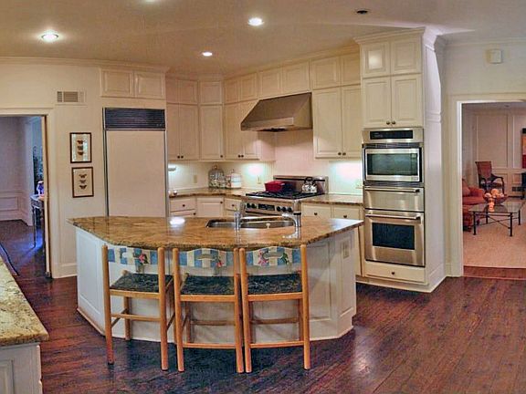 Fantastic open kitchen features Dacor range, granite counters...