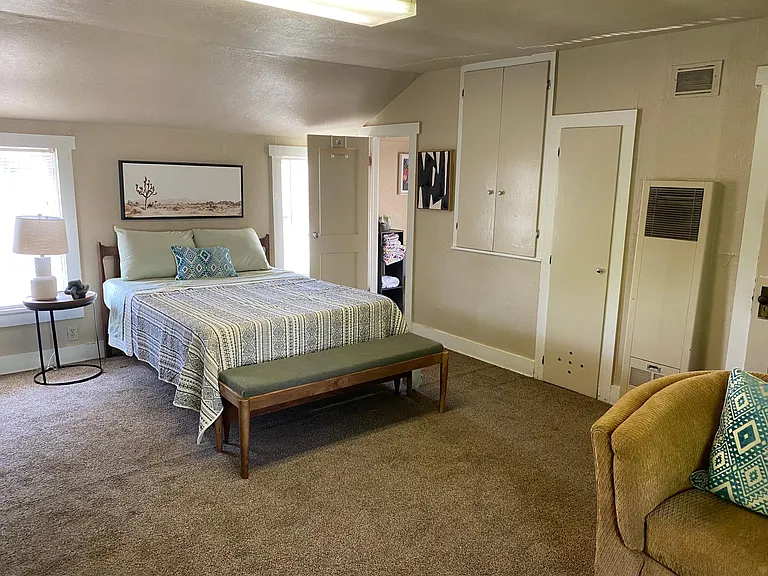 Comfortable Bed and chairs. Lots of windows for natural lighting.