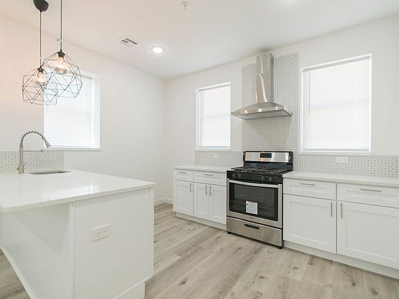 **New stainless steel refrigerator will be in the far corner.** If you love to cook you will love this stainless steel oven hood that will keep your apartment, air, furniture, and clothes fresh!