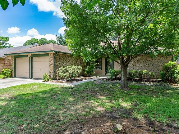 Mature landscaping in front yard.