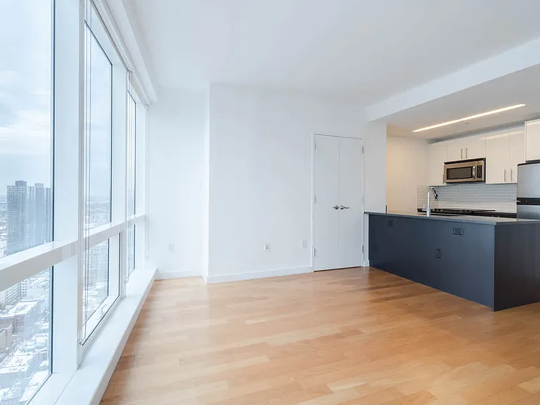Living Room with Hard Surface Flooring and Floor to Ceiling Windows