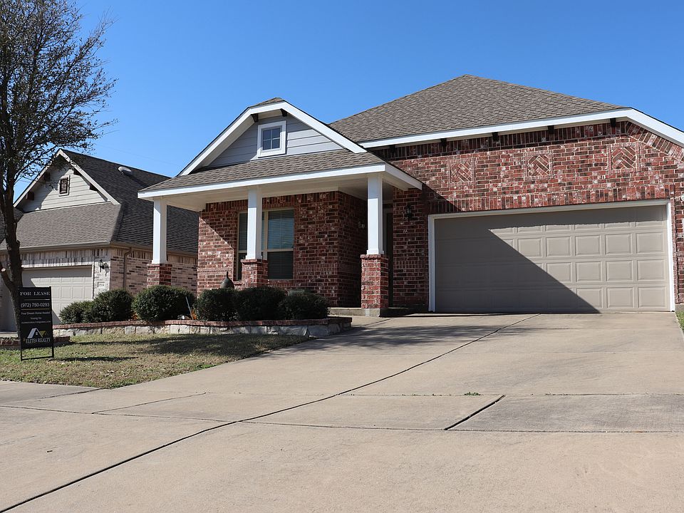 Charming curb appeal awaits! This beautifully maintained home features a welcoming front porch, and lush landscaping, and classic architectural details.