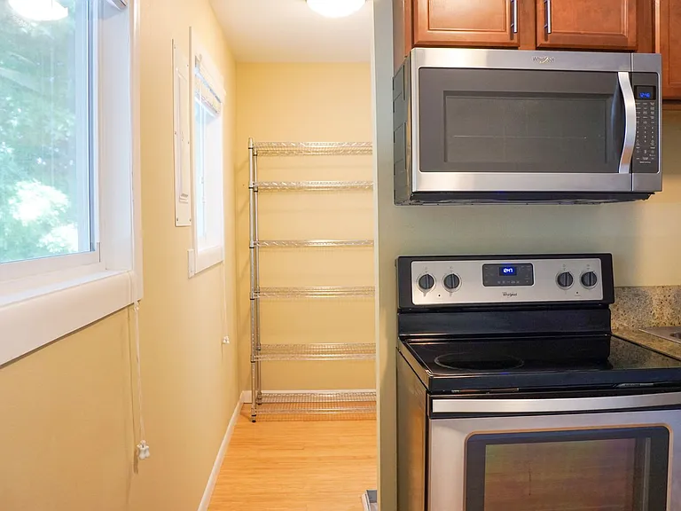 Top-Floor 2-Bedroom with Bamboo Flooring + Off-Street Parking! — Photo 3