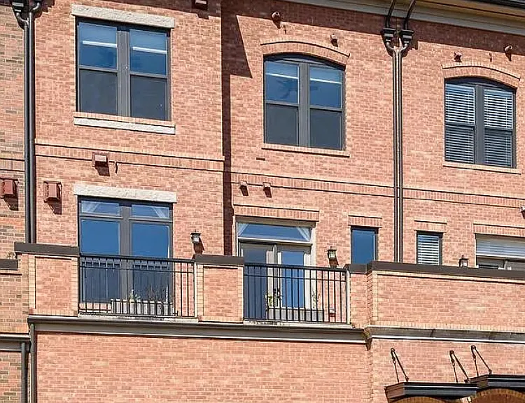 All brick townhouse with two outdoor decks