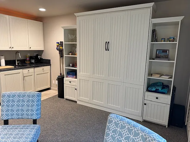 Wall bed opens up to queen.