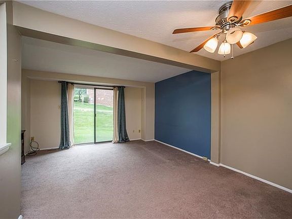 Large sliding door fills the living room with natural light.