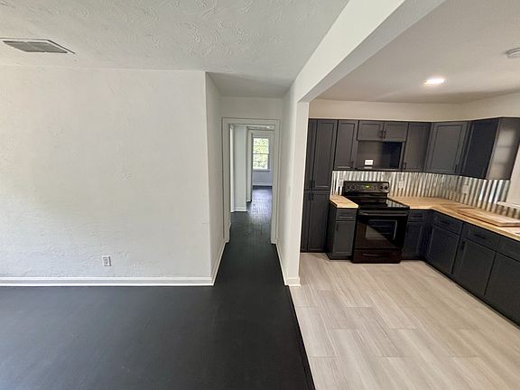 Looking down hallway from living room/kitchen