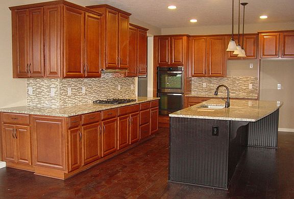The Mason B Kitchen with large island and hardwood floors