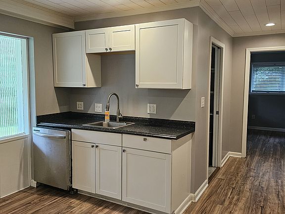 Kitchen with sink, dishwasher, storage