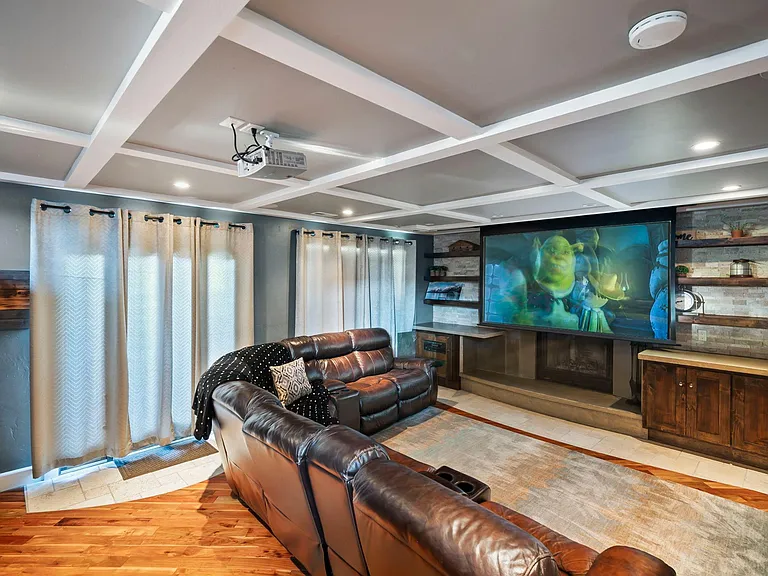 Wind down with your favorite movies on the 107 inch projector with surround sound.