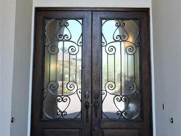 Mahogany Front Door with Clear Glass and Iron Design Inserts