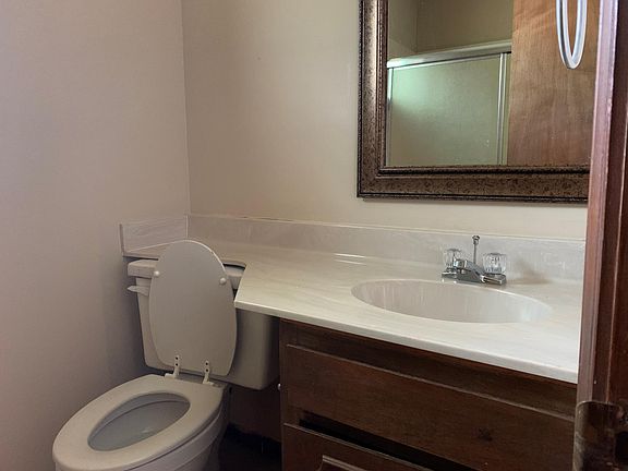 bathroom in bedroom - tub with glass doors for shower