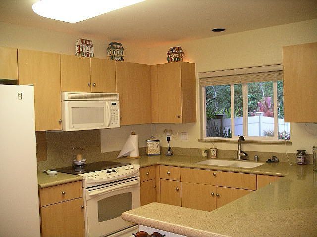 Kitchen, laminate floors, corian counters