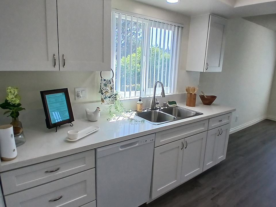 enter to large, bright, kitchen, with all new cabinets, quartz counters, plumbing, lighting. and appliances.