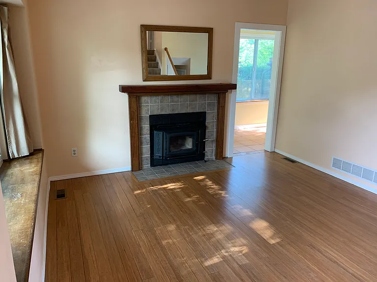 view from front door to wood stove and sunroom