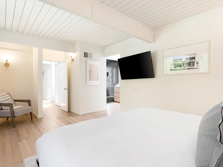 Primary suite with large Smart TV