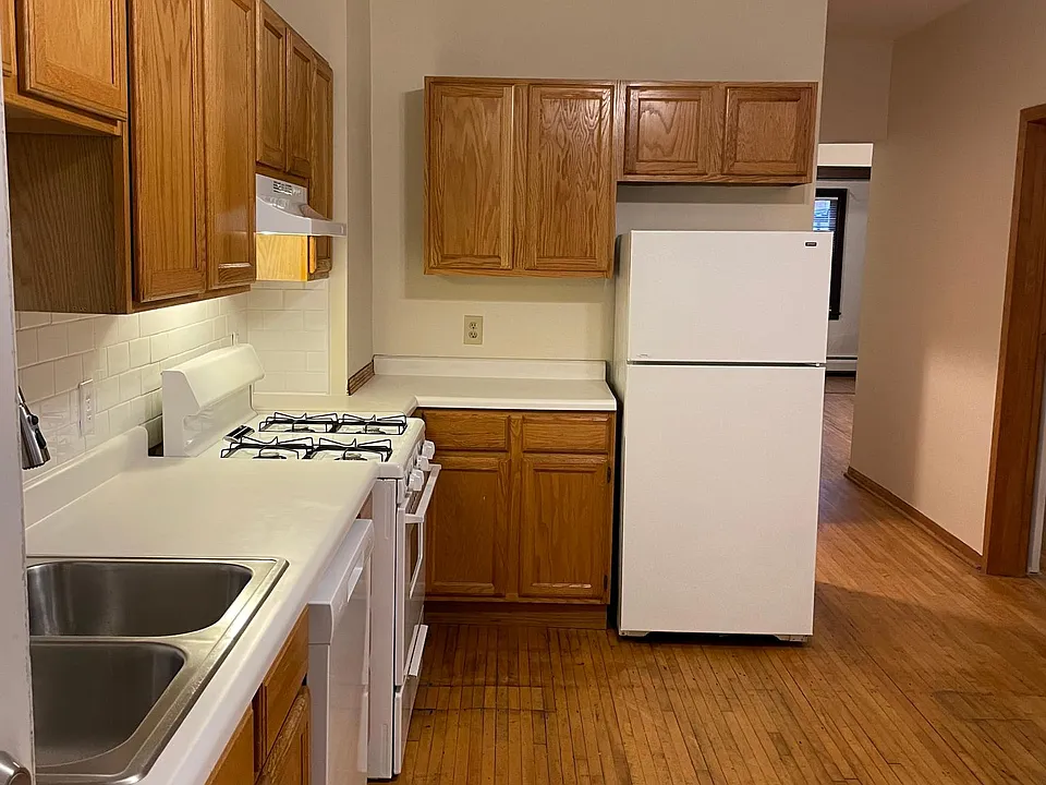 Kitchen with newer cabinets and dishwasher.