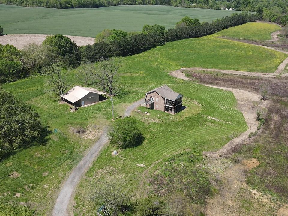 2410 Snyders Store Rd, Wingate, NC; 93+/- acres of which 57 acres are under a perpetual conservation easement. The property also features a 2 bedroom, 1.5 bath and barn.