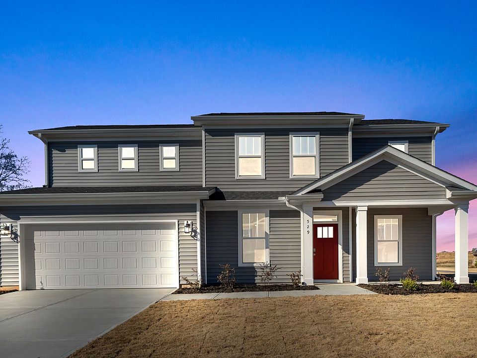 2 story, single family home with a covered front porch and spacious owner s suite