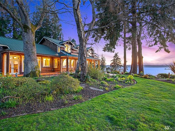 Beautifully manicured 1.7 acres in total with charming brick pathways and covered view patios.