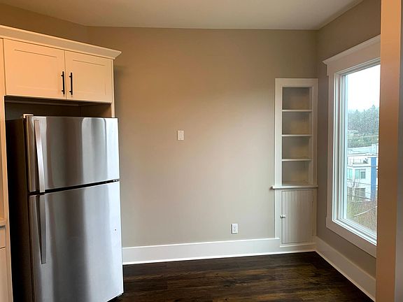 Kitchen nook area with charming storage shelves