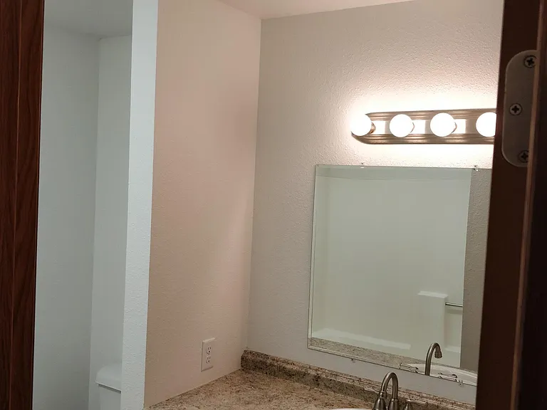 Bathroom w/shower to left and enough light for everyone.