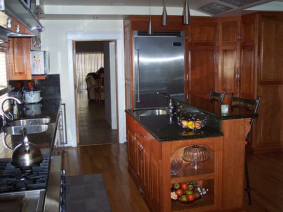 Chef's Kitchen With Granite Counter Tops And Viking Appliances