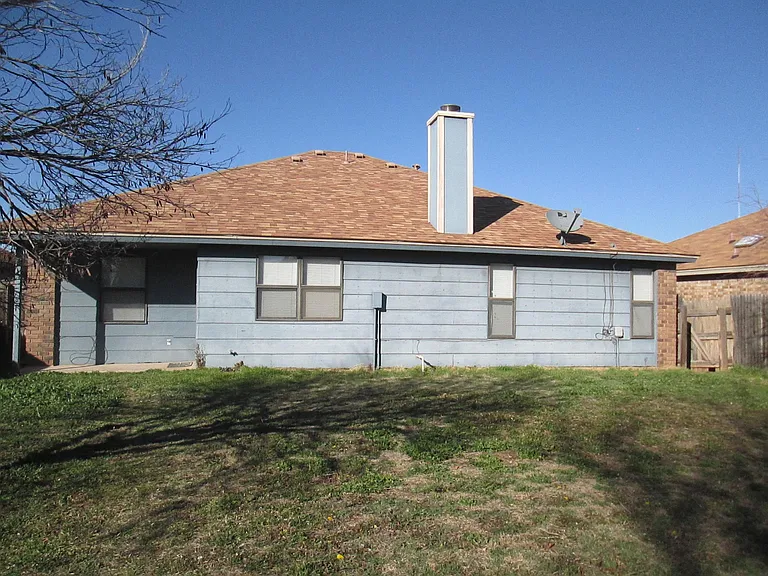 Back yard & back of home