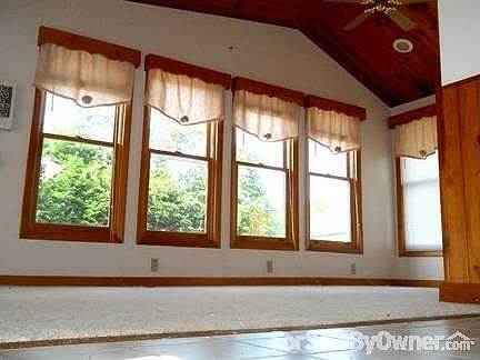 Florida Room (rear of house) : Overlooks landscaped lawn, circular brick patio, plenty of natural su